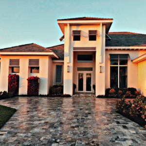 TravaCast The entrance of a large white home