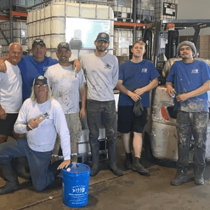 a group of workers posing for a picture